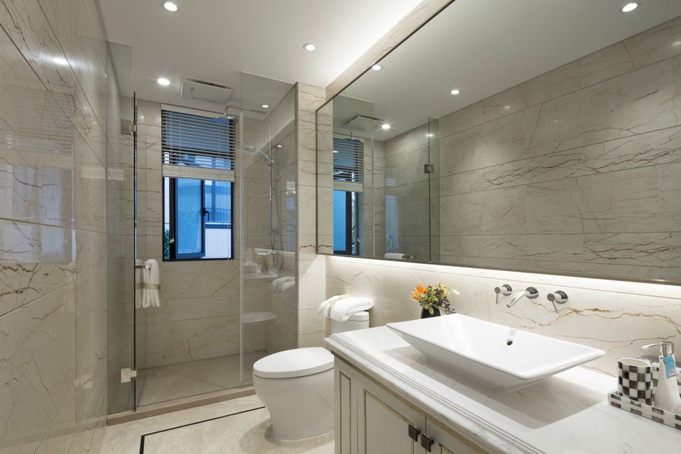Modern bathroom with a glass walk-in shower and a white vessel sink